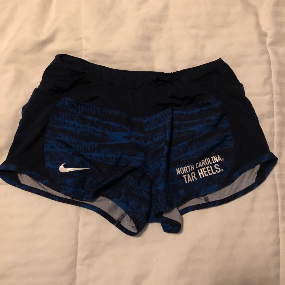 Navy and blue Nike running shorts w/ NC Tar Heel